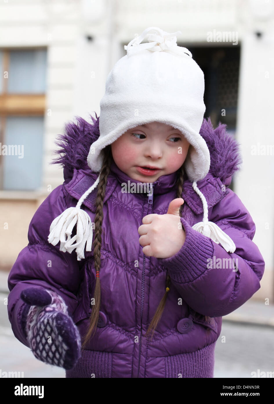 Portrait of beautiful girl giving thumbs up Stock Photo - Alamy