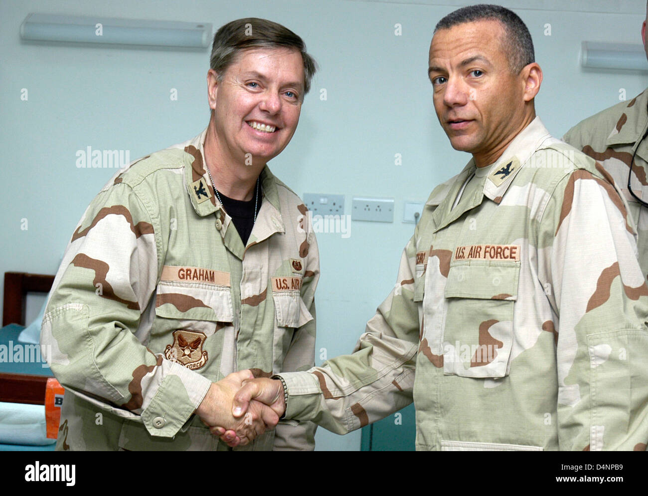 Col. Lindsey Graham (left), a US Senator from South Carolina is welcomed by Col. Andrew Montiero in the Contingency Air Medical Staging Facility April 9, 2007 at Balad Air Base, Iraq. Col. Graham is a Reserve Judge Advocate with the National Guard. Stock Photo