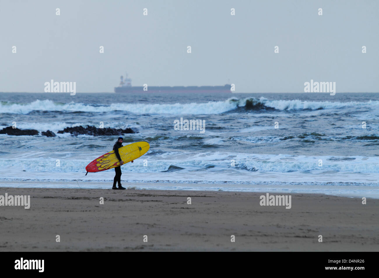 Winter surfing in the Atlantic ocean off Ballybunion beach on Ireland's west coast, County Kerry, Republic of Ireland Stock Photo