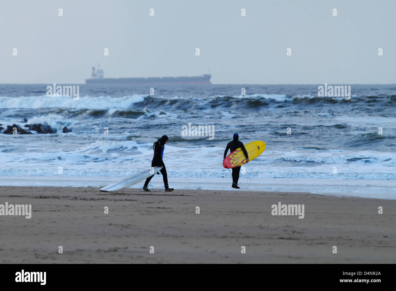 Winter surfing in the Atlantic ocean off Ballybunion beach on Ireland's west coast, County Kerry, Republic of Ireland Stock Photo