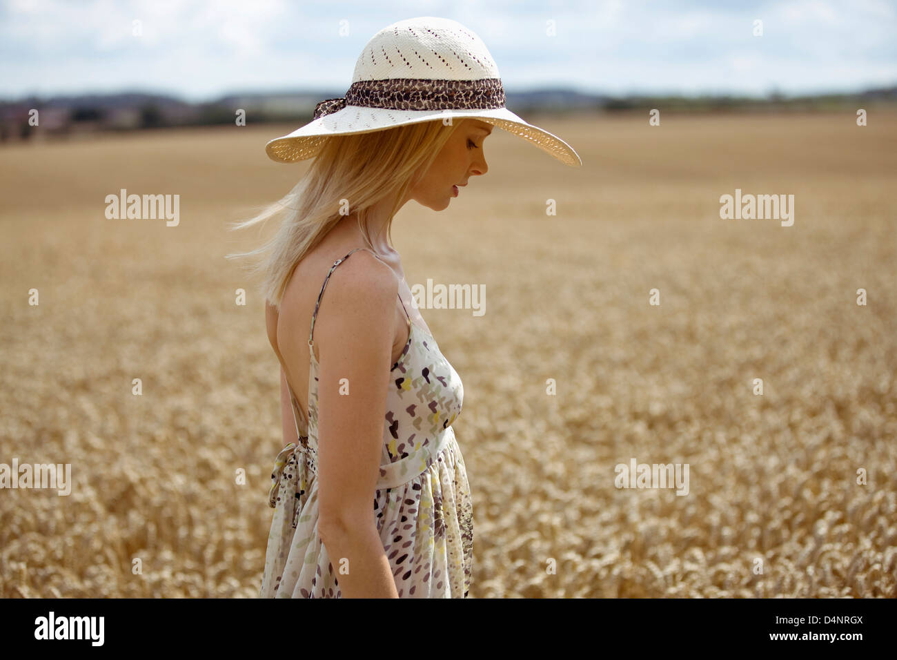 Walking field woman side view hi-res stock photography and images - Alamy