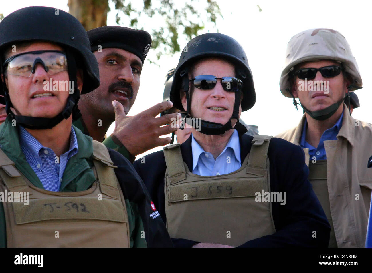 Iraqi Lt. Col. Hussein Hamid Issa, head instructor at the Kirkuk Police Academy, talks to US Senator John McCain (center), Senator Lindsey Graham (left) and Utah Governor Jon Huntsman, Jr. during a congressional fact-finding mission November 23, 2007 to northeastern Iraq. Stock Photo