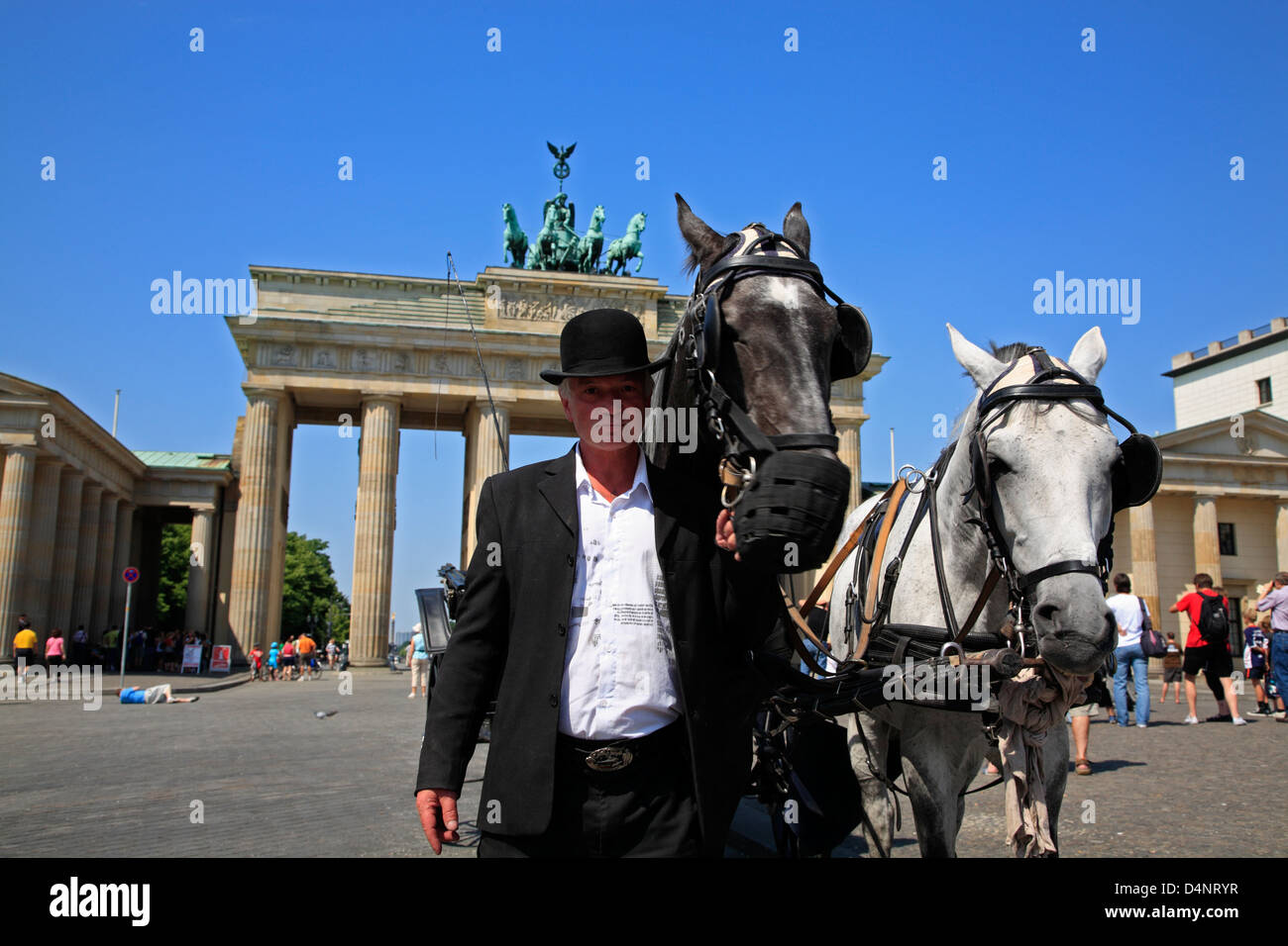 Coachman waiting for tourists with his carriage, Brandenburg Gate, Berlin, Germany Stock Photo