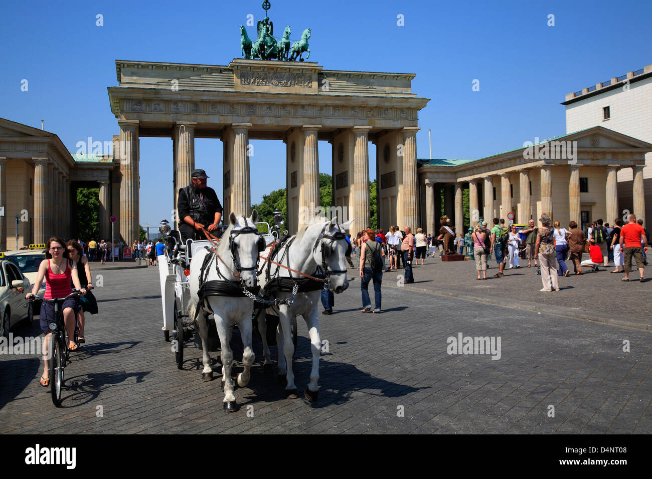 Horse drawn carriage starts sightseeing tour at Brandenburg Gate, Brandenburger Tor, Berlin, Germany Stock Photo