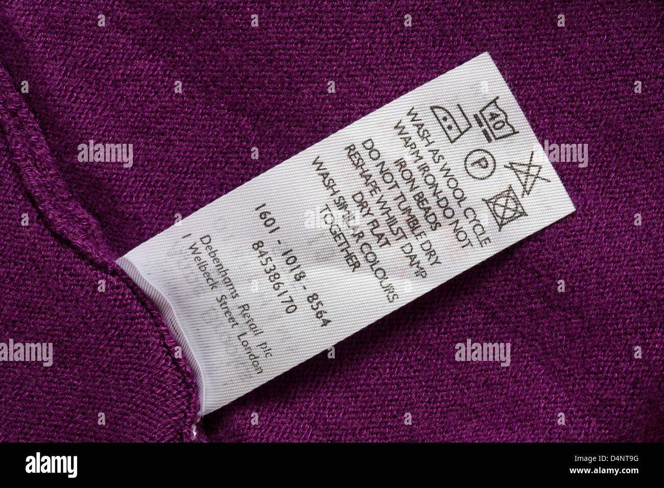 label with washing instructions in jumper - care washing symbols and instructions Stock Photo