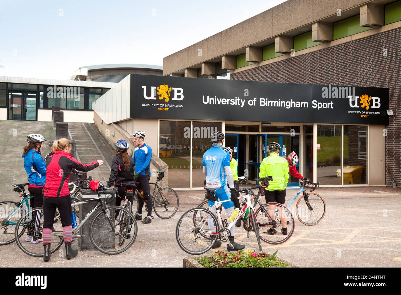 Students cycling for sport at the University of Birmingham Sports Centre, Birmingham UK Stock Photo
