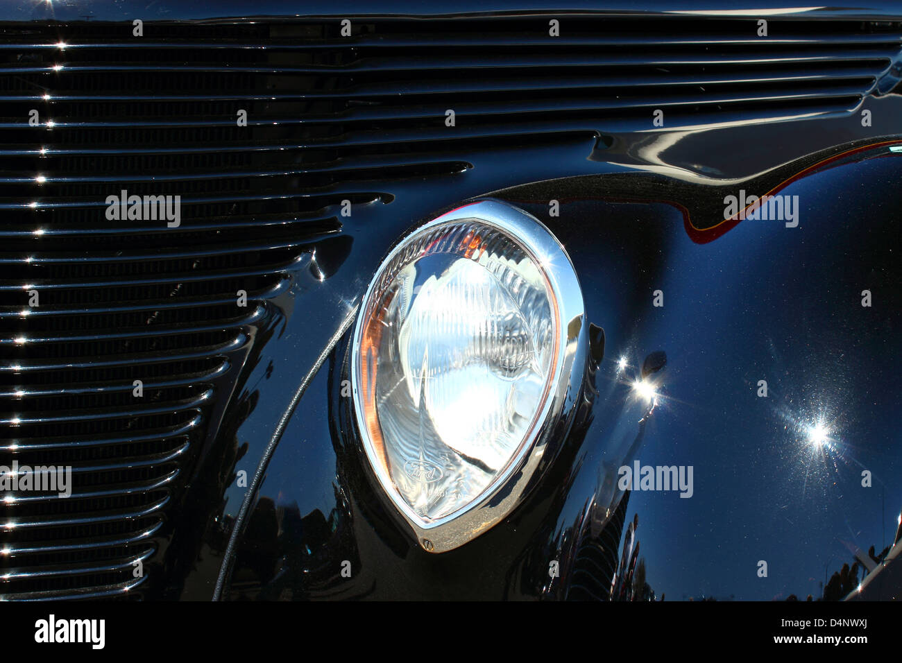 Close up view of grill and headlight on a Vintage refurbished street rod. Stock Photo