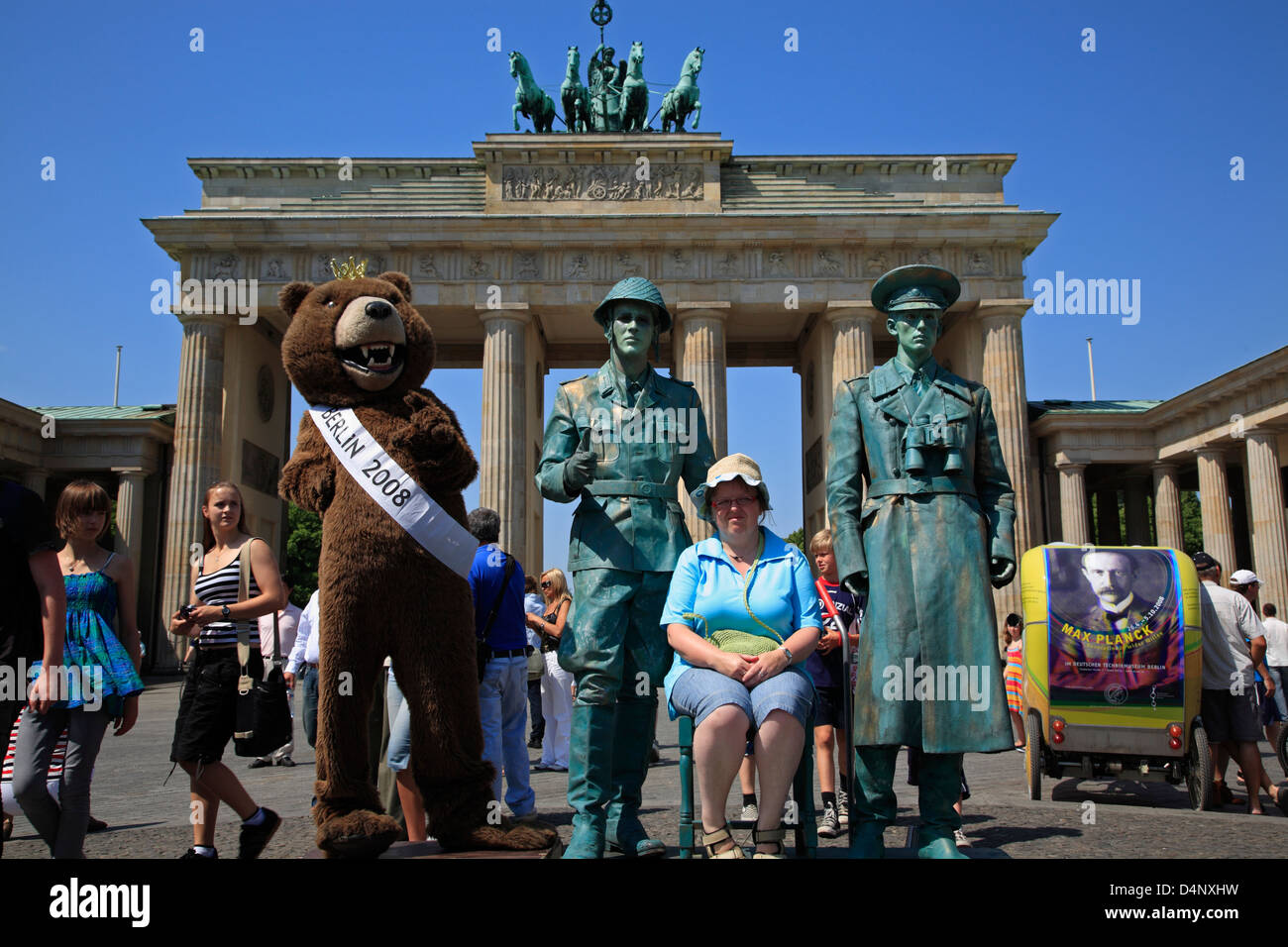 Street performer dressed as Soldiers posing for tourists in front of Brandenburg Gate, Berlin, Germany Stock Photo