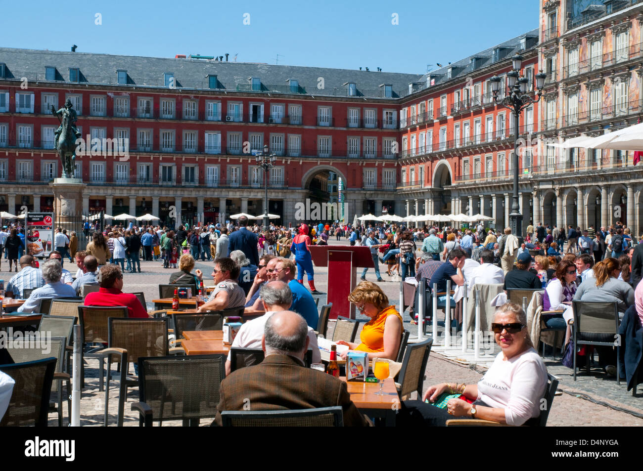 People sitting on terraces at the Main Square. Madrid, Spain. Stock Photo
