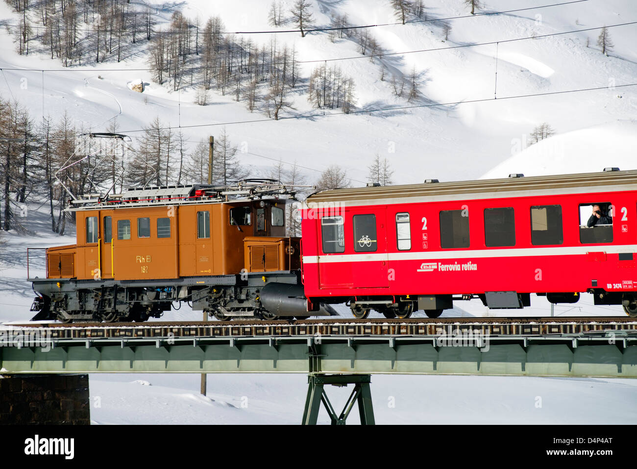 Crocodile locomotive at Bernina Pass in winter, Grisons, Switzerland Stock Photo