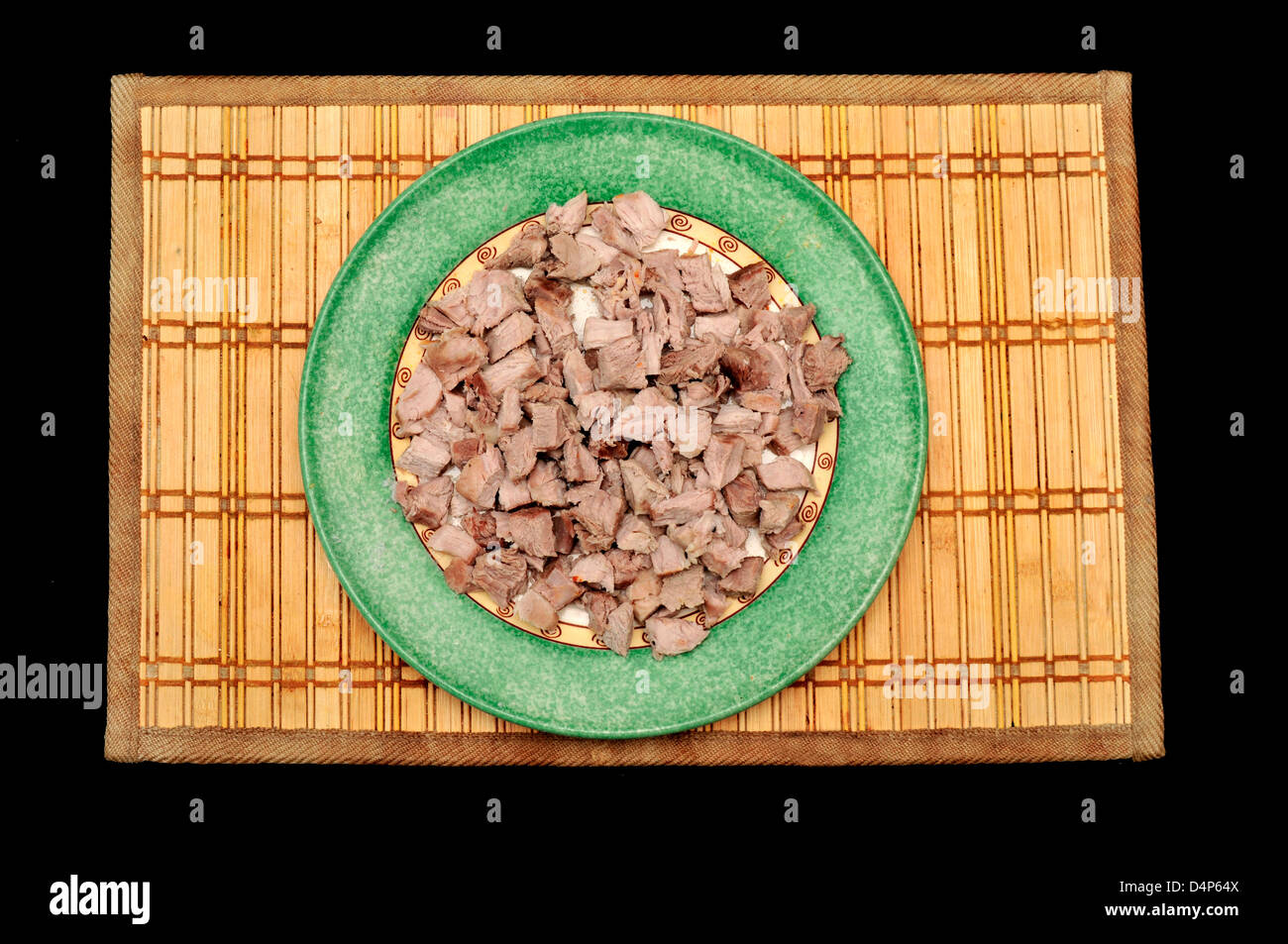Plate with pieces of boiled meat Stock Photo
