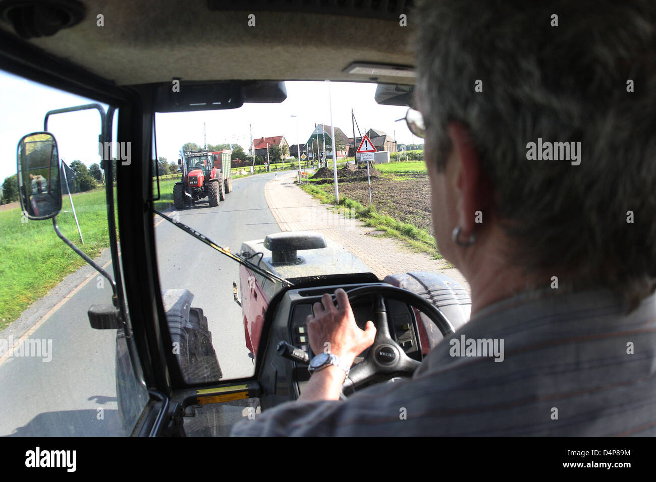Hamm, Germany, farmer goes on a country road Stock Photo