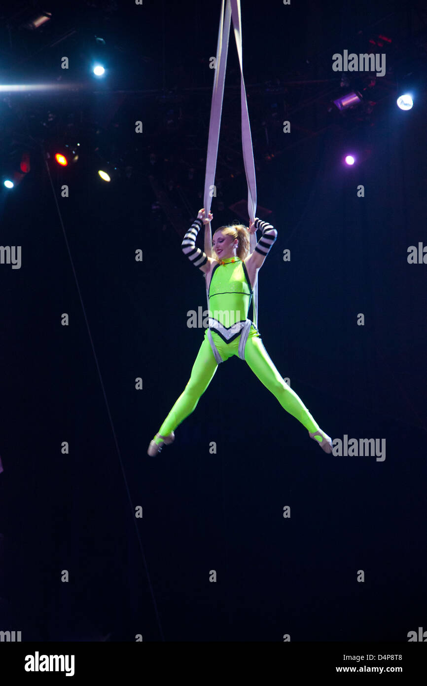 Character flat drawing female acrobat perform on the trapeze while