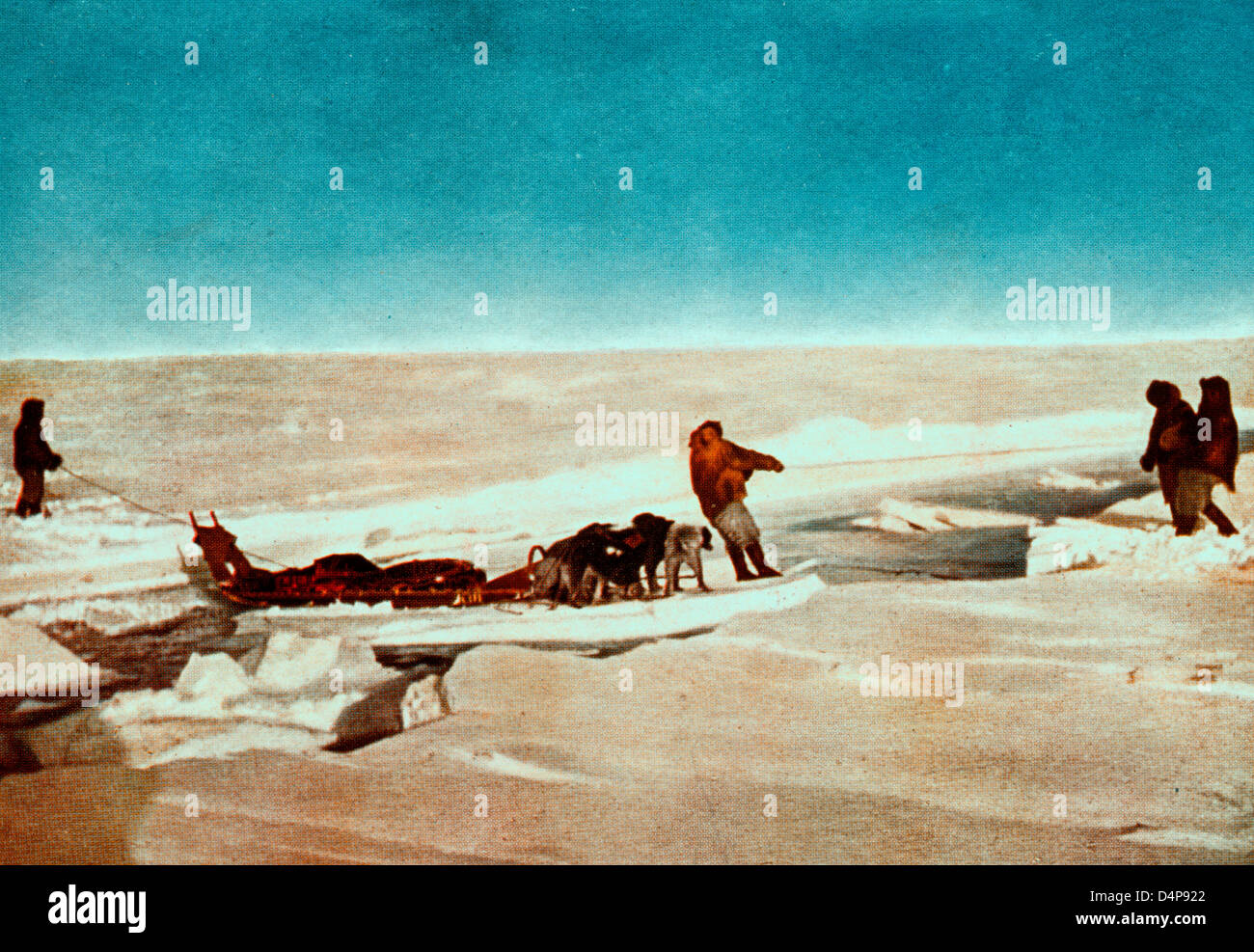Men and dog sled crossing water on piece of an iceberg. Crossing a lead ...