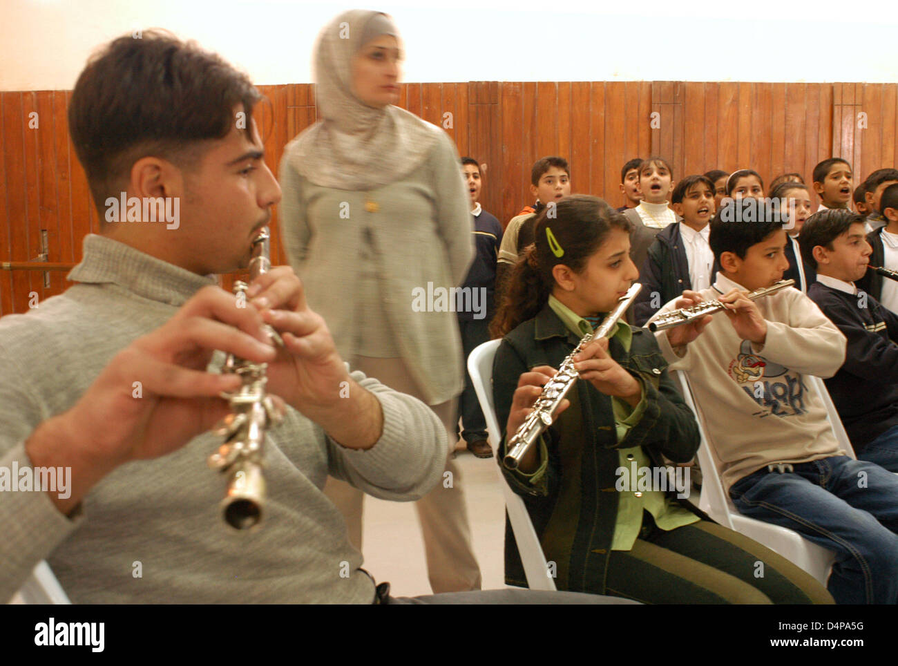 Music and Dance Centre in Baghdad. Children of high class prepare a concert. The music is not always able to calm the savage beast. Stock Photo