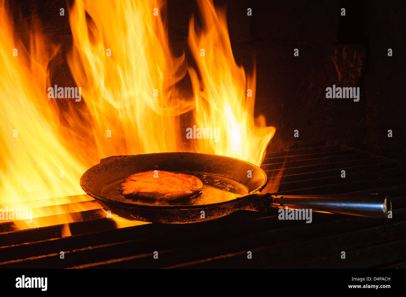 Cooking food in pan in charcoal kiln, Hunneberg, Sweden, Europe Stock Photo