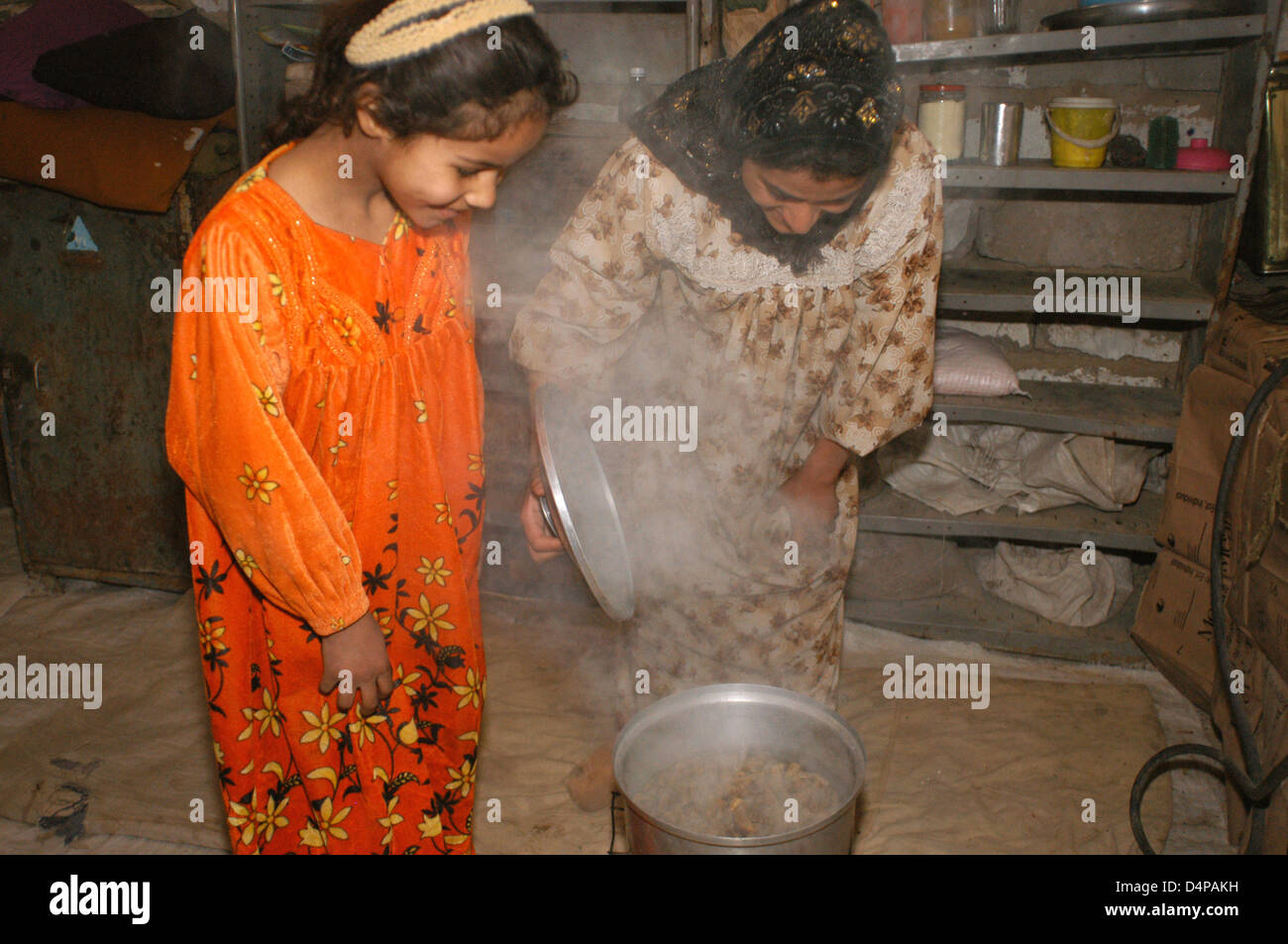 Mother and daughter cooking- Stock Photo