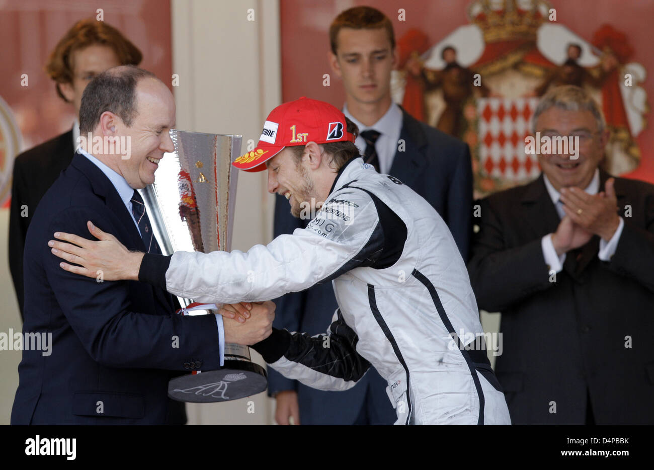 Prince Albert II of Monaco (L) hands the trophy to British Formula One  driver Jenson Button of Brawn GP after the Formula One Grand Prix of Monaco  in Monte Carlo, Monaco, 24