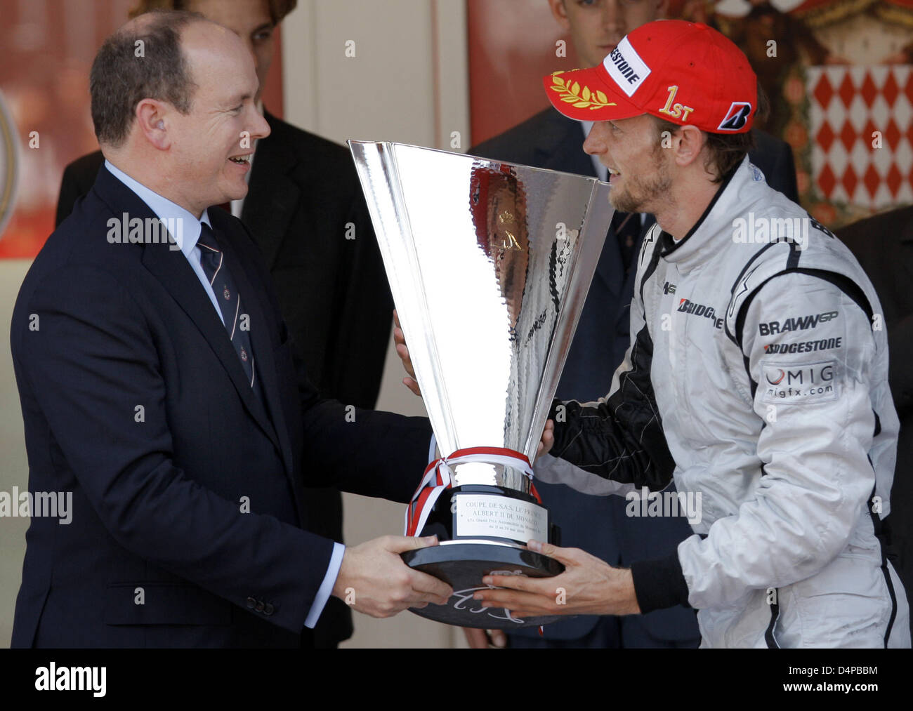 Prince Albert II of Monaco (L) hands the trophy to British Formula One  driver Jenson Button of Brawn GP after the Formula One Grand Prix of Monaco  in Monte Carlo, Monaco, 24