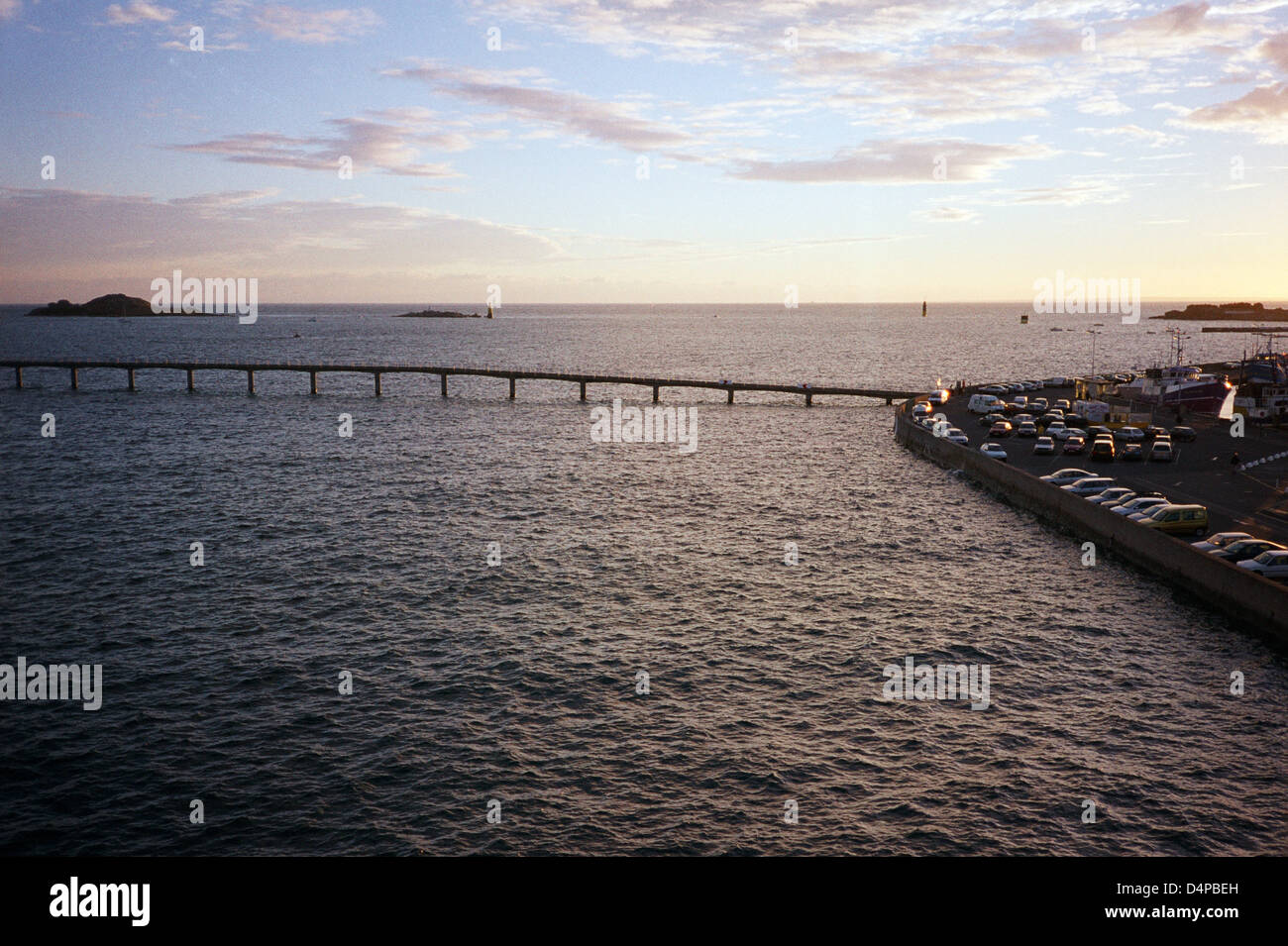 Harbour wall and causeway, Roscoff, France, evening Stock Photo