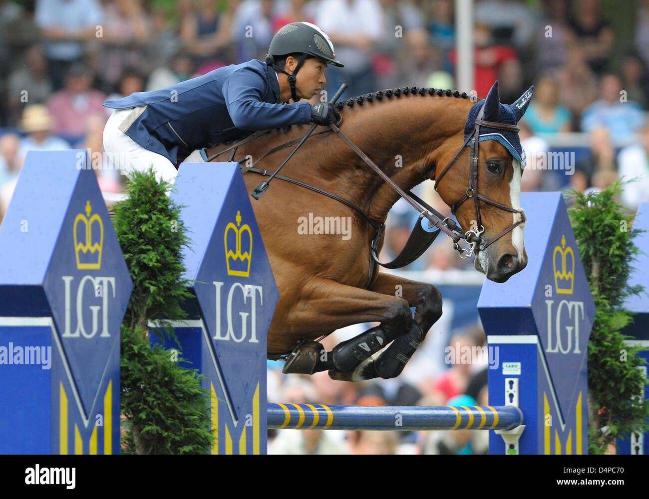 Japanese equestrian Taizo Sugitani and his horse ?Avenzio? take an