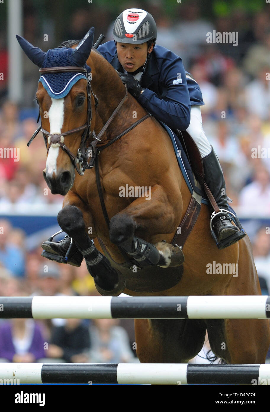 Japanese equestrian Taizo Sugitani and his horse ?Avenzio? take an