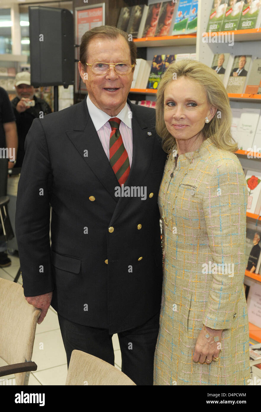 British actor and UNICEF Ambassador Roger Moore (L) and his wife ...