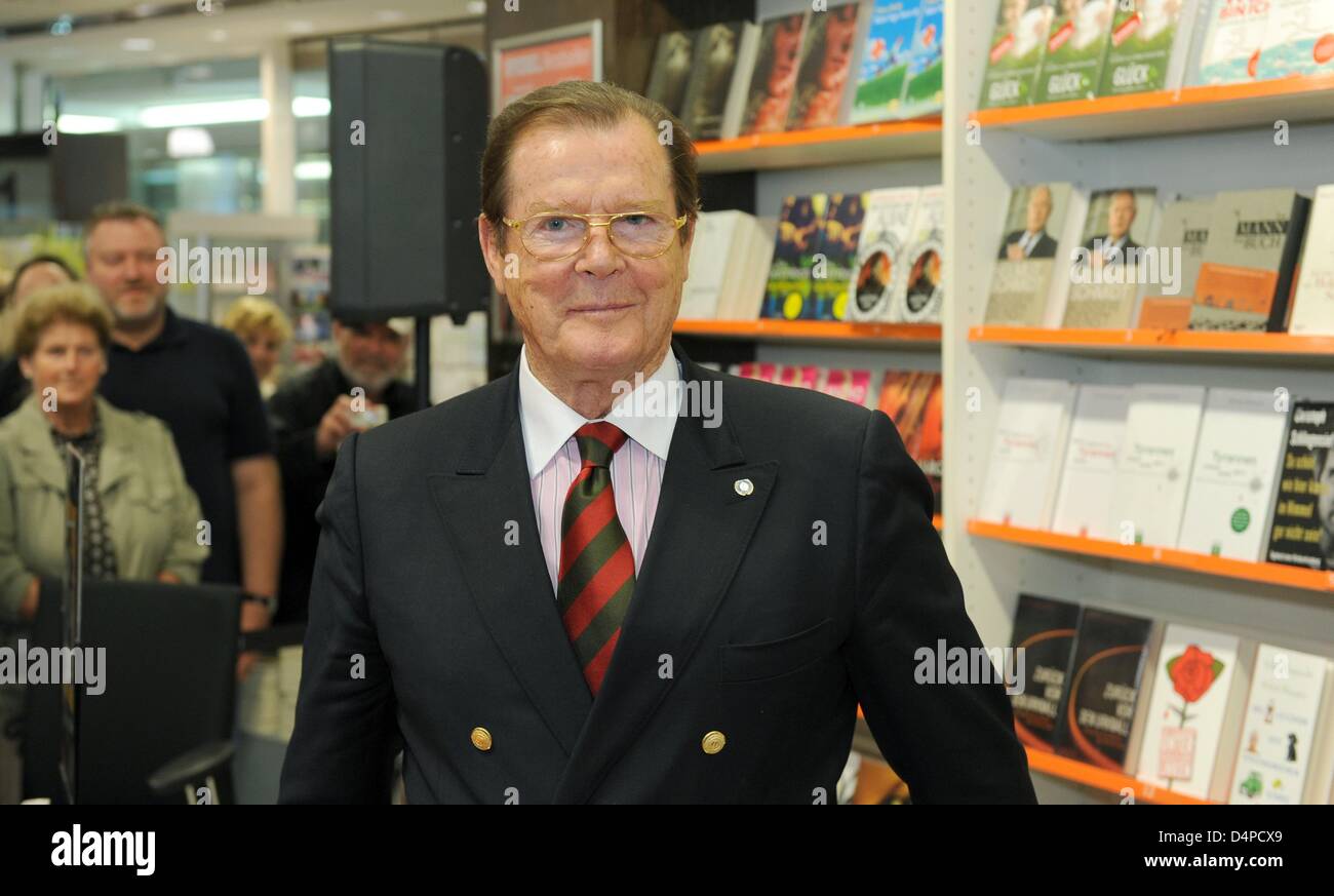 British actor and UNICEF Ambassador Roger Moore presents his ...