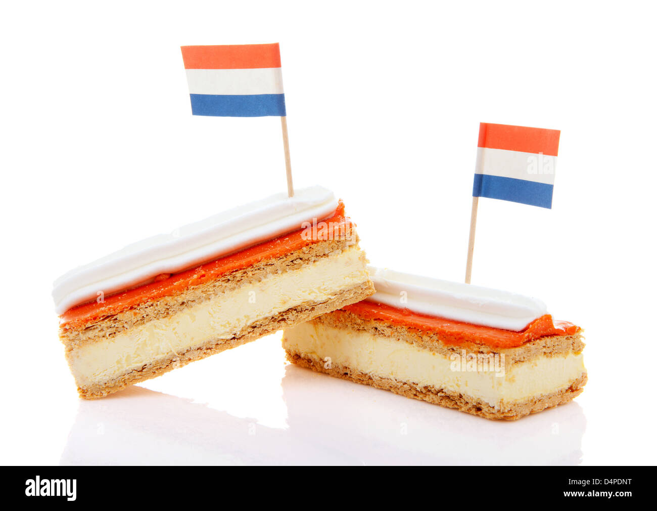 Two traditional Dutch pastry called tompouce with flags over white