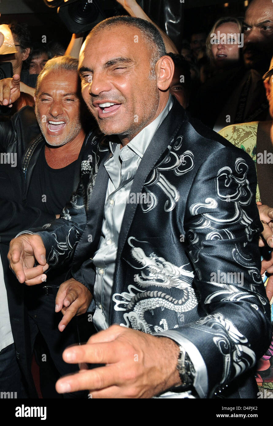 Designer Christian Audigier (R) arrives for the party of his