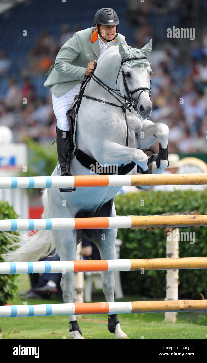 Germany?s jumping equestrian Marco Kutscher and his horse