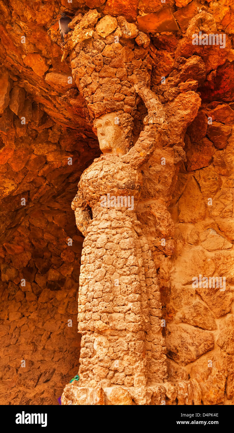 Stone Woman Colonnaded Footway Under Viaduct designed by Antoni Gaudi Guell Park, Barcelona, Catalonia, Spain Stock Photo