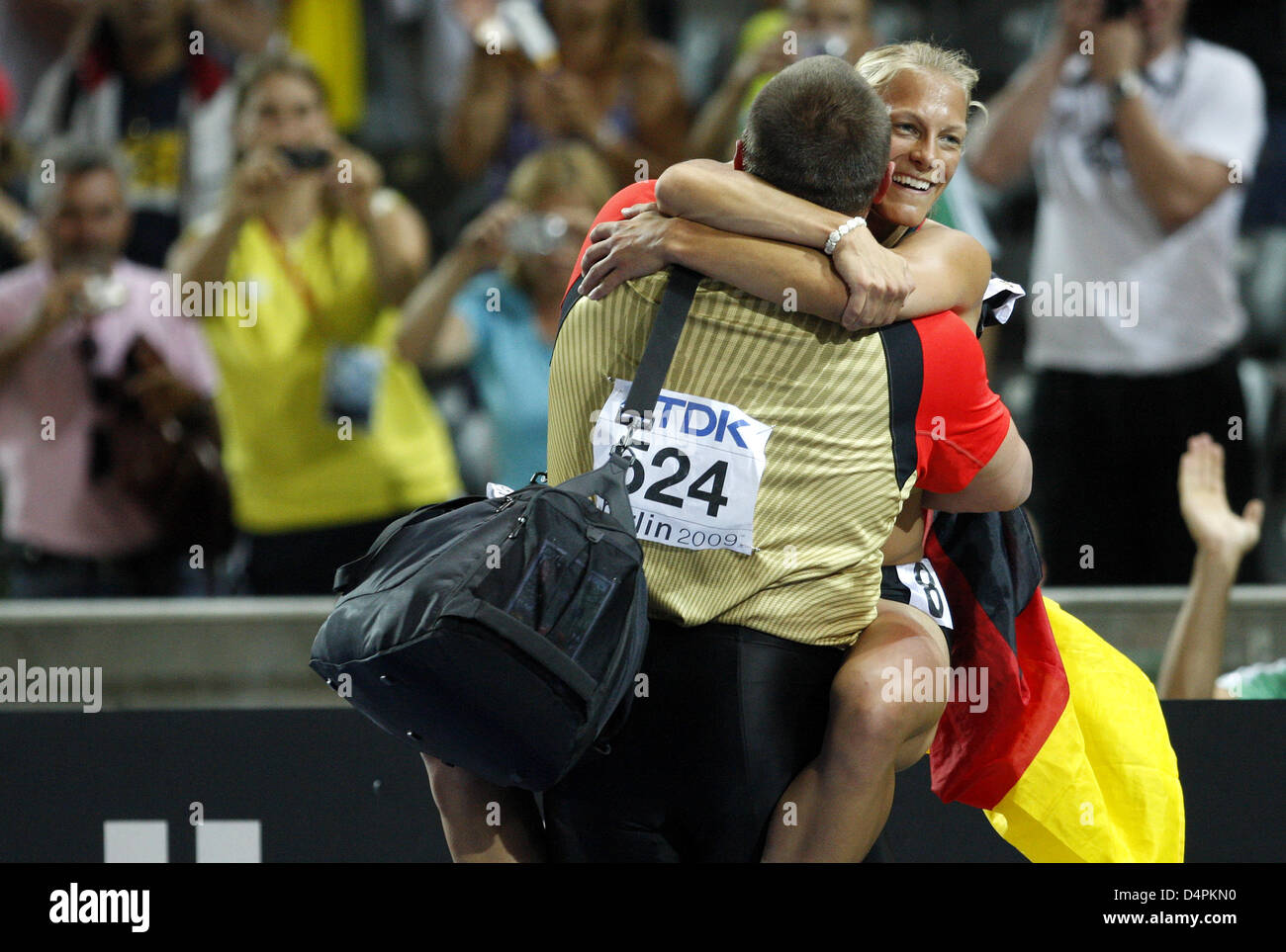 German Ralf Bartels celebrates with German heptathlete Jennifer Oeser after winning the bronze medal in the shot put final at the 12th IAAF World Championships in Athletics in Berlin, Germany, 15 August 2009. Photo: KAY NIETFELD Stock Photo