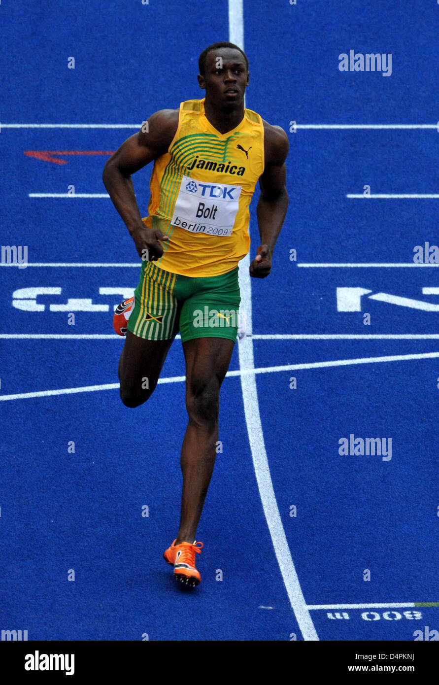 Jamaica?s Usain Bolt finishes a 100m heat at the 12th IAAF World ...