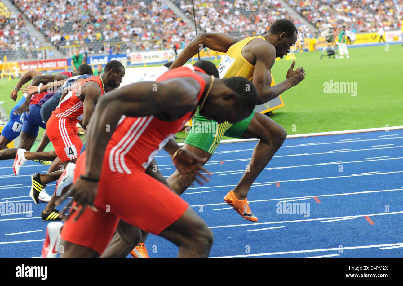 Jamaican Usain Bolt (R) makes a false start at the men?s 100m semi final at the 12th IAAF World Championships in Athletics in Berlin, Germany, 16 August 2009. Photo: HANNIBAL Stock Photo