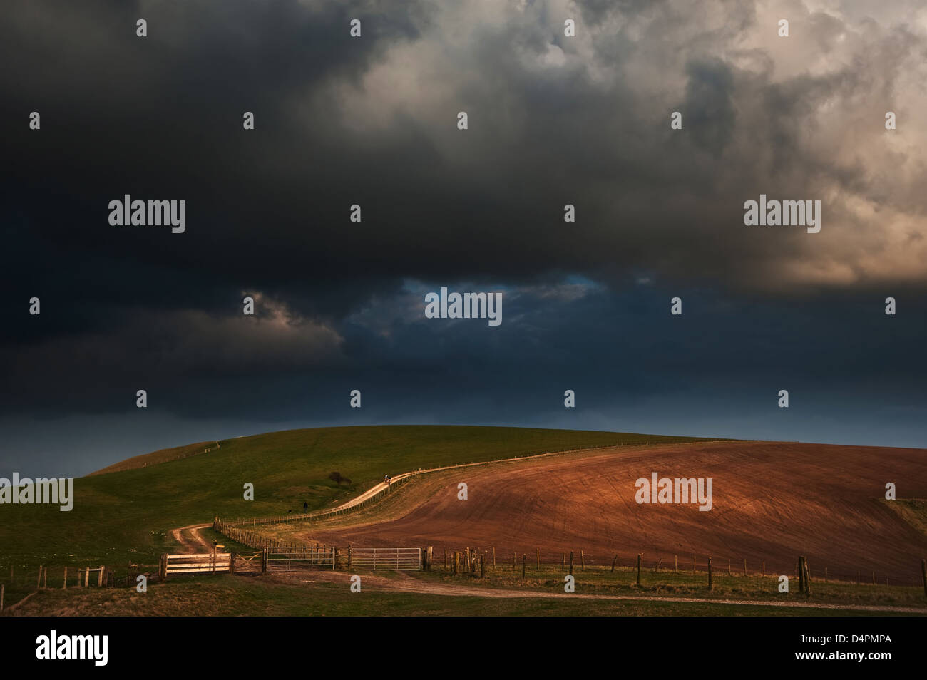 Beautiful countryside landscape across rolling hills with lovely cloud formations Stock Photo