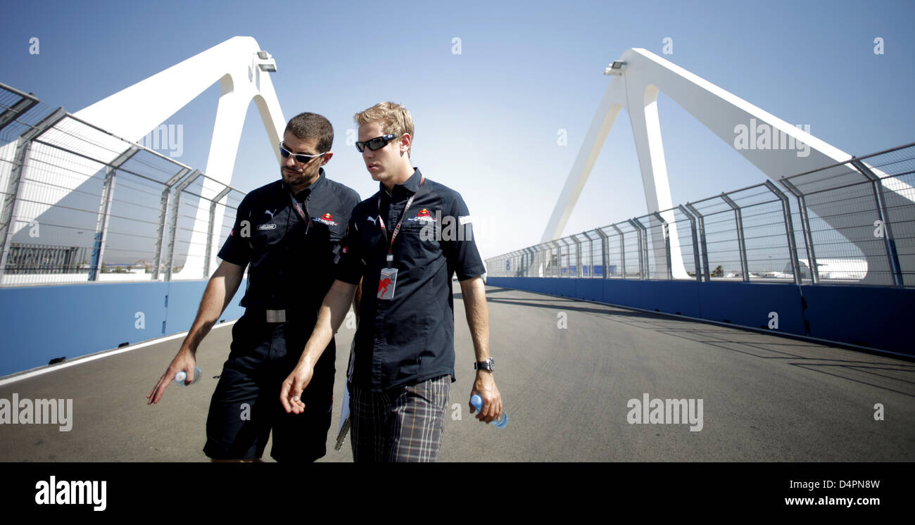 German Formula One driver Sebastian Vettel (R) and engineer Guillaume Rocquelin of Red Bull Racing inspect the Valencia Street Circuit in Valencia, Spain, 20 August 2009. The Grand Prix of Europe will take place on Sunday, 23 August 2009. Photo: Felix Heyder Stock Photo