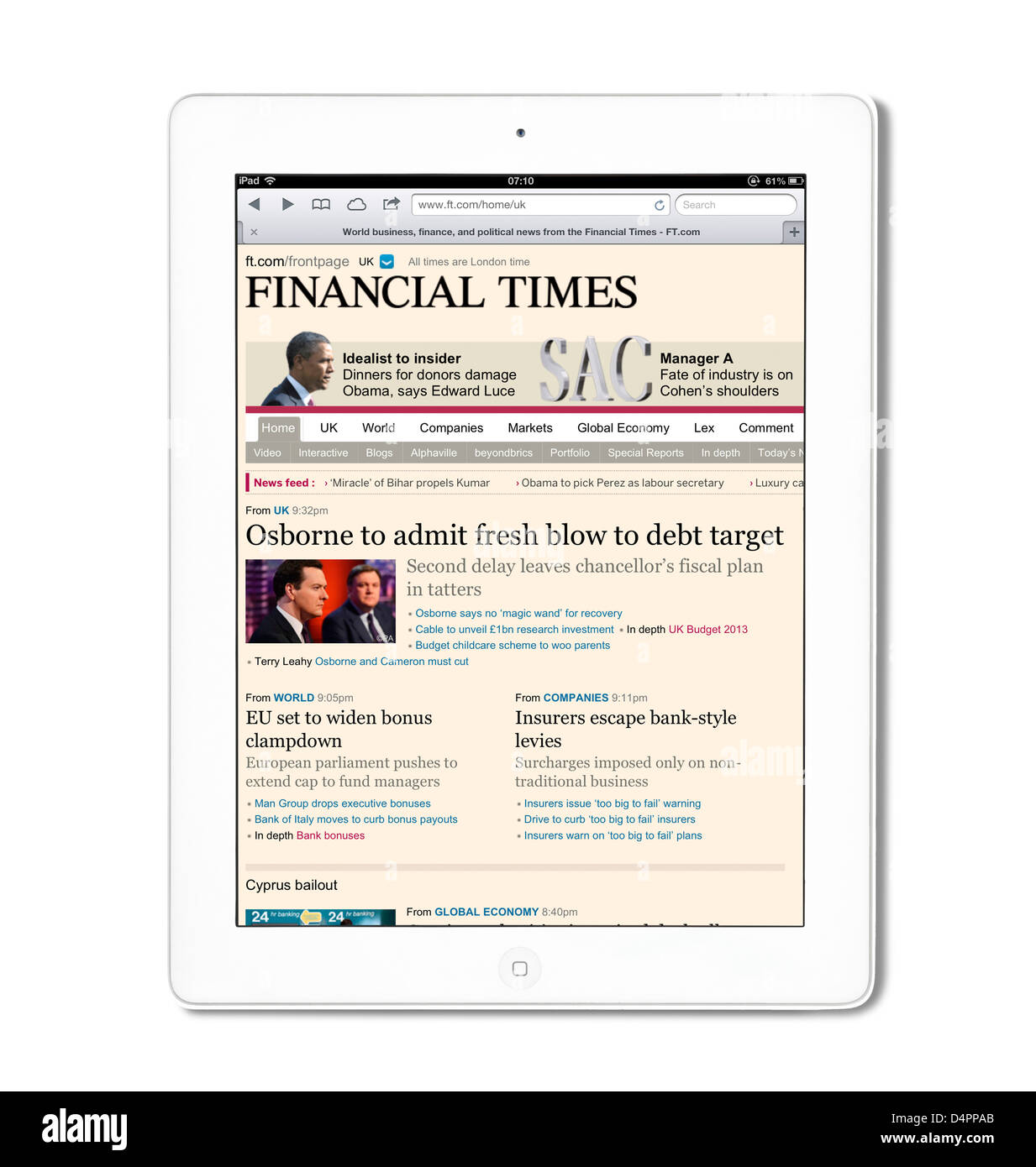 Reading the online edition of the Financial Times newspaper on a 4th Generation iPad, UK Stock Photo
