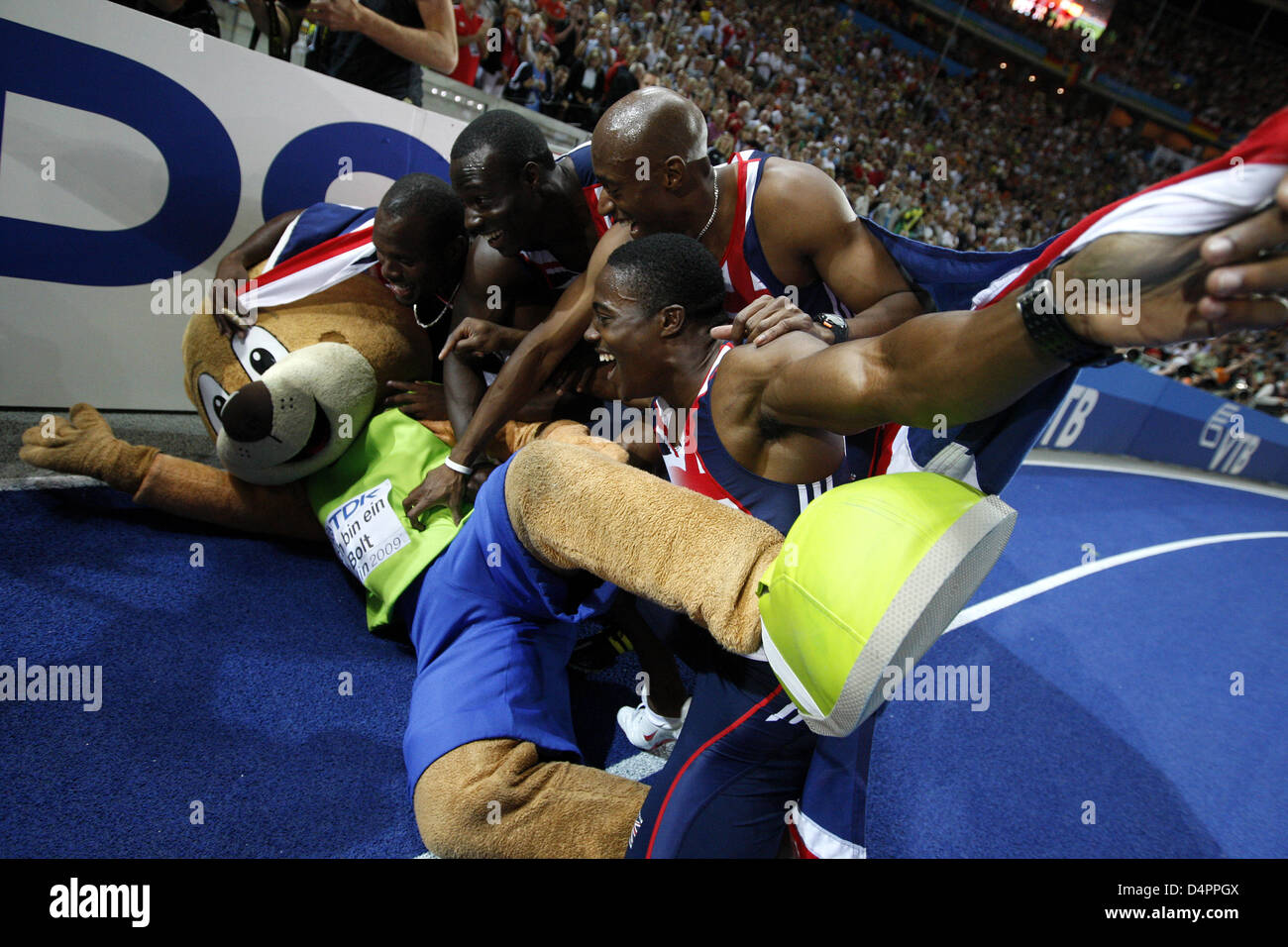 Great Britain?s 4x100m relay team celebrates with Mascot Berlino after winning the silver medal in teh 4x100m Relay finals at the 12th IAAF World Championships in Athletics Berlin 2009 in Berlin, Germany, 22 August 2009. Photo: Kay Nietfeld Stock Photo