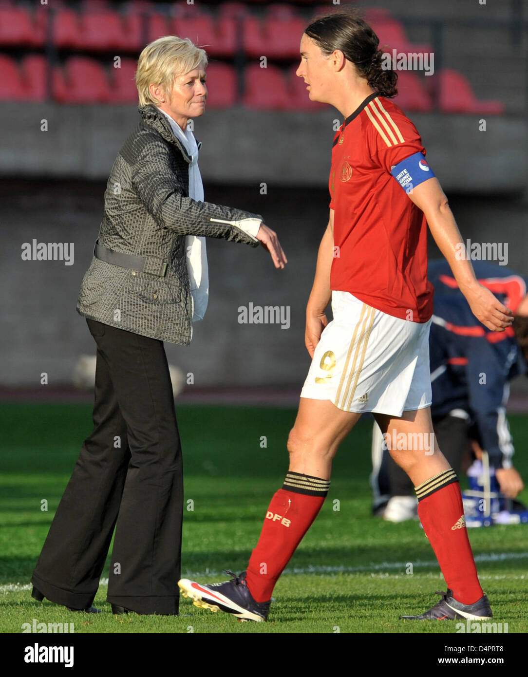 Germany?s hrad coach Silvia Neid (L) cheers striker Birgit Prinz (R ...