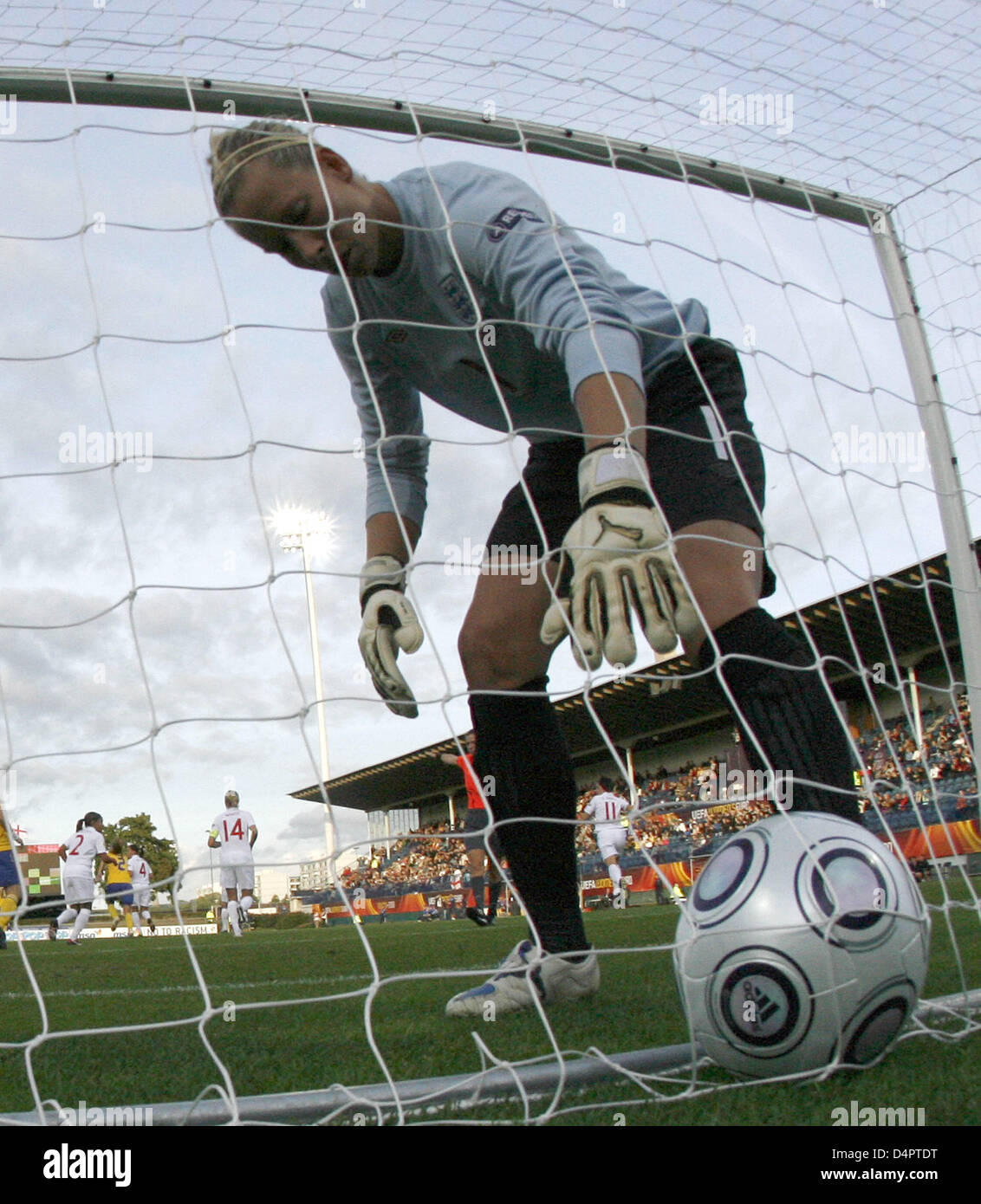 England?s goalie Rachel Brown gets the ball after receiving the 11