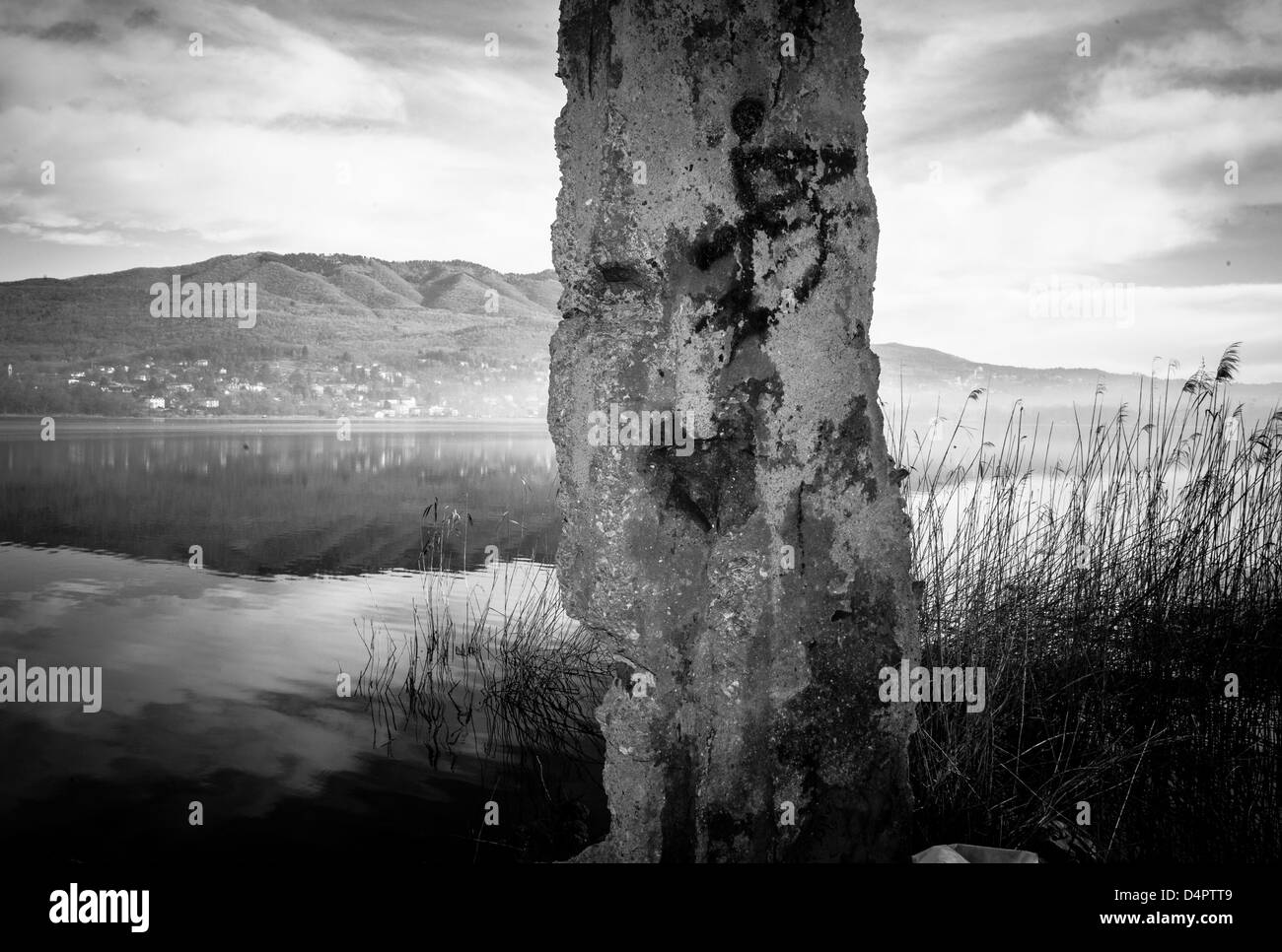 landscape of Lake Varese, through a broken wall,Varese,Lombardy,Italy Stock Photo