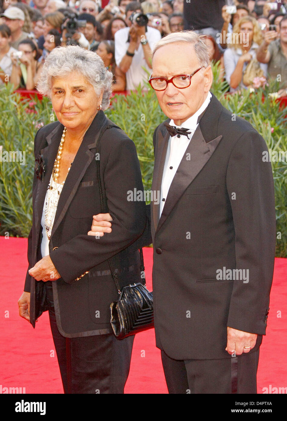 Italian composer Ennio Morricone and his wife Maria Travia arrive at
