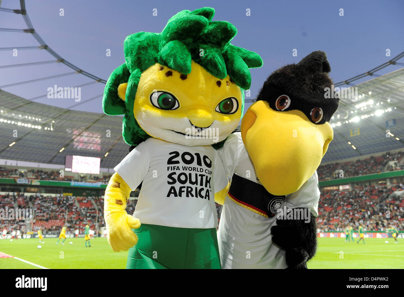 Germany?s national team mascot Paule (R) and Zakumi (L), maascot of the 2010 FIFA World Cup pose ahead of the friendly match Germany v South Africa at BayArena stadium of Leverkusen, Germany, 05 September 2009. Germany won the match 2-0. Photo: Achim Scheidemann Stock Photo