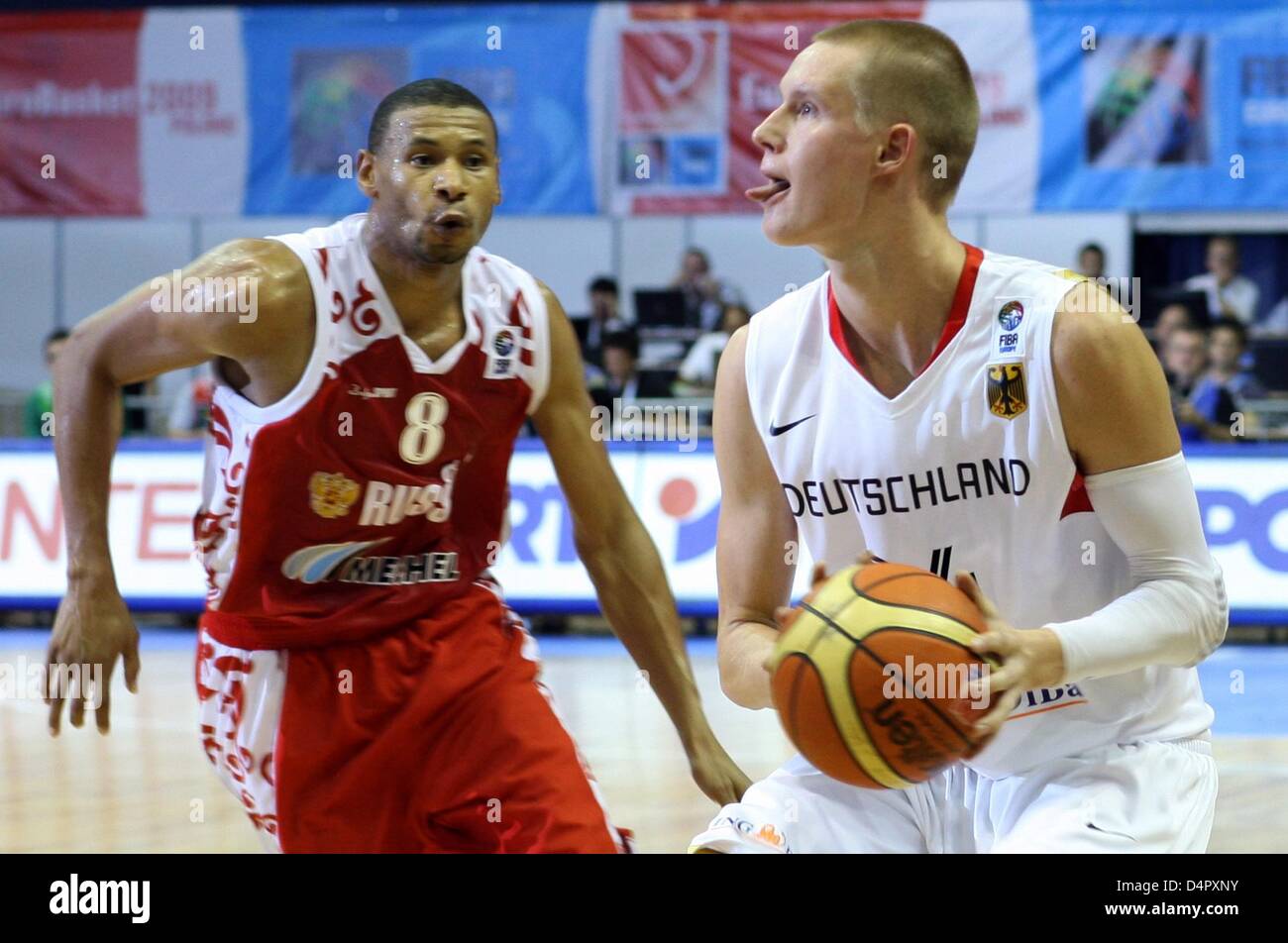 Germany?s Robin Benzing (R) and Russia?s Kelly Mc Carty vie for the ball  during the Basketball European Championships preliminary round match  Germany vs Russia at Olivia Hall in Gdansk, Poland, 08 September