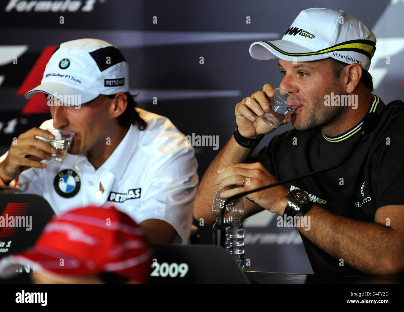 Polish Formula One driver Robert Kubica of BMW Sauber (L) and Brazilian