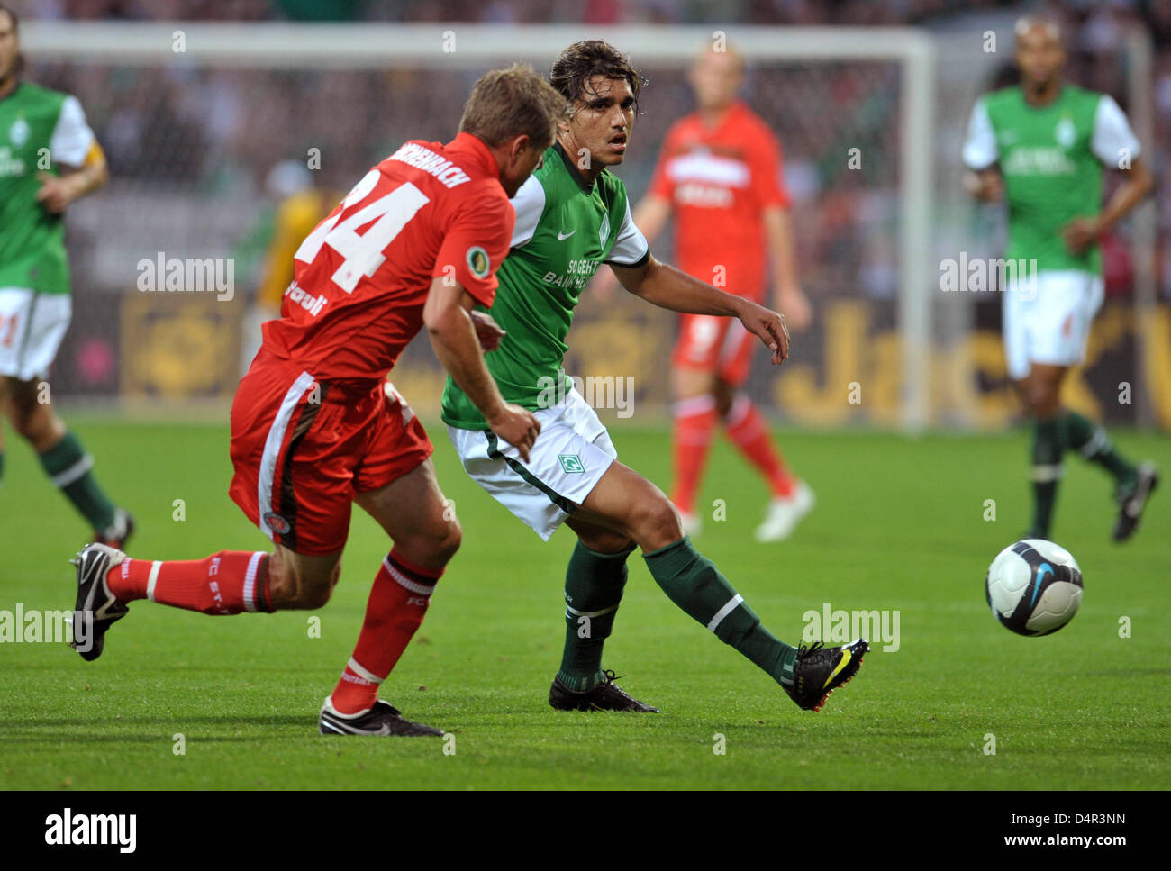 Bremen?s Marcelo Moreno (R) fights for the ball with St. Pauli?s Carsten Rothenbach during the German DFB Cup second round match Werder Bremen vs FC St. Pauli at Weser Stadium in Bremen, Germany, 23 September 2009. Bremen defeated St. Pauli 2-1. Photo: Carmen Jaspersen Stock Photo