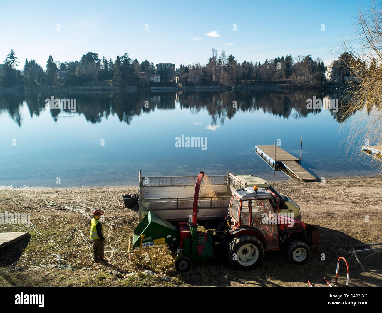 gardeners-at-work-ticino-river-sesto-calende-lombardy-italy-stock