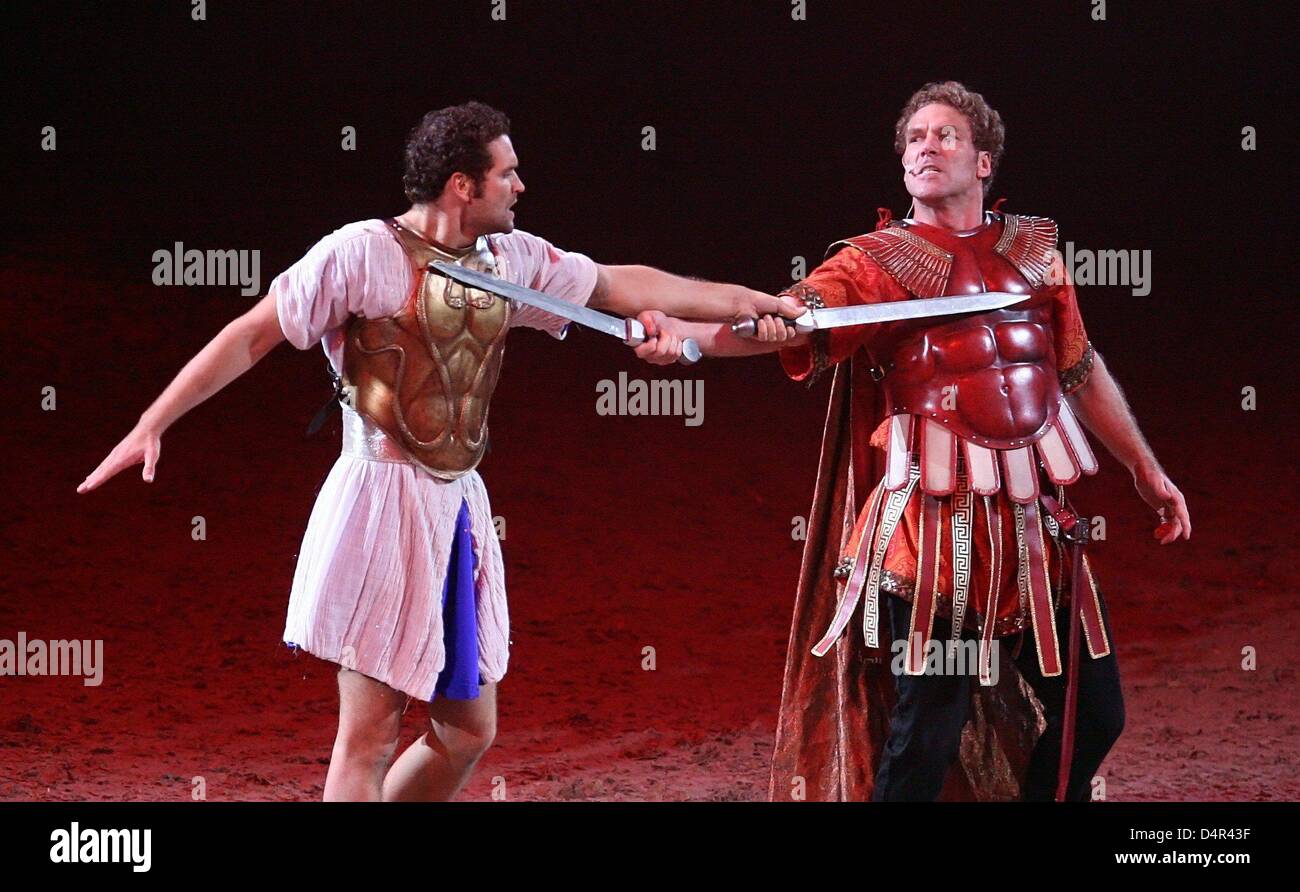 Actor Sebastian Thrun as Judah Ben Hur (L) and Michael Knese as Messala perform at the German premiere of the monumental show ?Ben Hur Live? at Color Line Arena in Hamburg, Germany, 25 September 2009. Some 400 actors and 100 animals bring back Roman times with chariot races, gladiators and galleys on a 360-degree stage. After three performances in Hamburg the show will move on to S Stock Photo