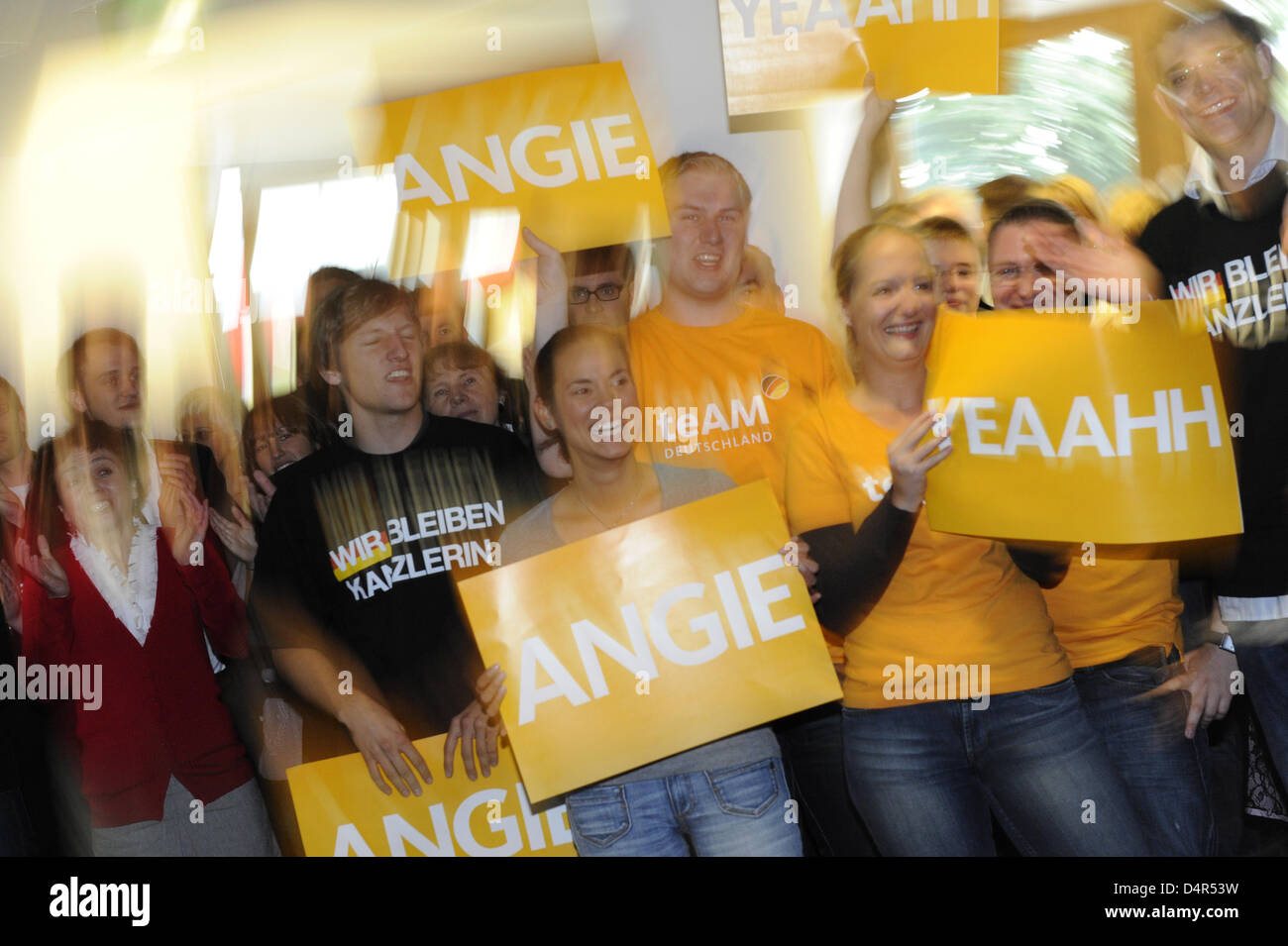 Young CDU (Christian Democratic Union) supporters cheer as German Chancellor and CDU party leader arrives for a chair meeting at ?Konrad-Adenauer-Haus? in Berlin, Germany, 28 September 2009. Angela Merkel said 28 September coalition negotiations with the Free Democrats (FDP) would get under way in the coming week. Merkel met senior party members and was expected to meet Guido Weste Stock Photo